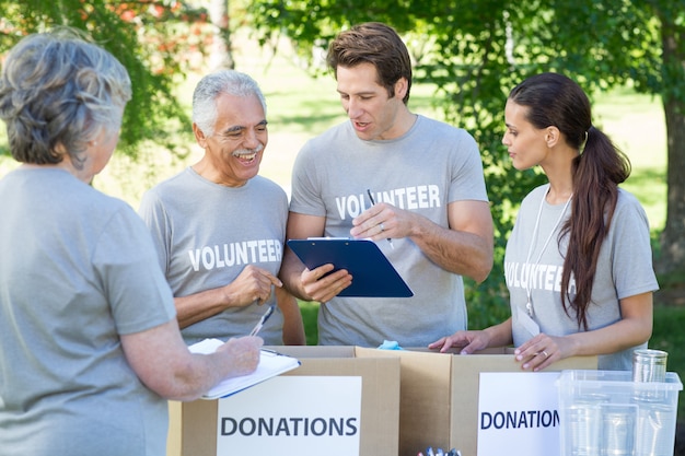 happy-volunteer-writing-clipboard_13339-267952